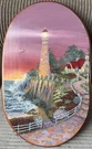 Vintage Sunset Lighthouse Wall Art - Pink, Red, Green Wooden Village Scenery. Fixed Price $39.90.
