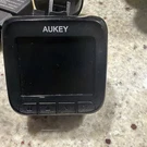 Aukey Dash Cam Full Hd 1080P Wide Angle Lens DR01A1905B3261 With Obd. Fixed Price $25.00.