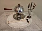 Oster Stainless Steel Fondue Set With Tray, Eight Forks Wood Made Japan. Fixed Price $40.00.