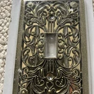 New Filigree Wallplate Single Toggle Antique Brass Finish Amerelle Switch Cover. Fixed Price $8.00.