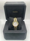 Tiffany & Co. Tesoro Watch With Round White Face 18K Yellow Gold. Fixed Price $17640.00.
