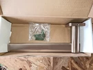 Kohler 23526-BV Towel Arm In Brushed Bronze. Fixed Price $102.70.