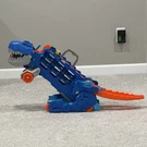 Hot Wheels City Toy Car Track Set, Ultimate T-rex Transporter, Dinosaur Hauler. Fixed Price $35.19.